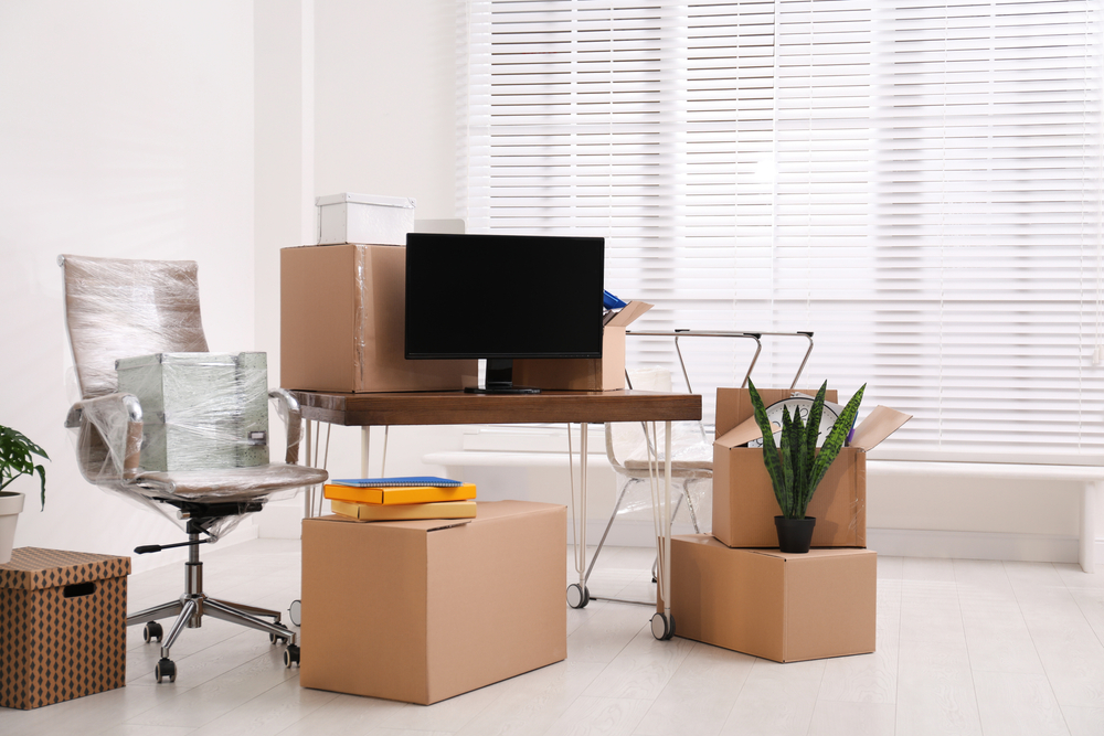 Cardboard,Boxes,And,Packed,Belongings,In,Office.,Moving,Day